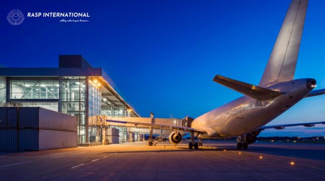 Cargo containers being loaded onto an aircraft at an international airport loading bay for export shipment from India